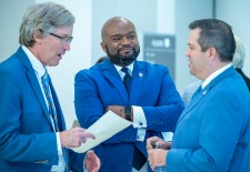 3 men in blue suits