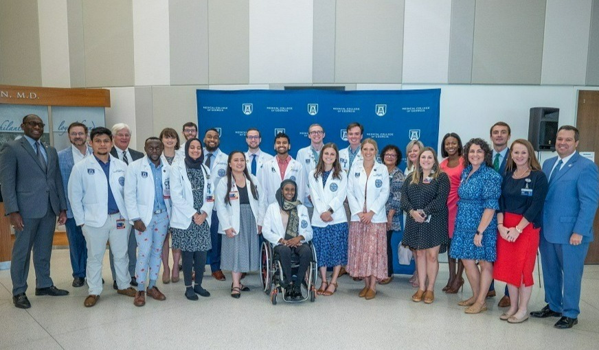 The first two cohorts of Peach State Scholars are joined by representatives of the MCG Foundation and External Relations and supporters of the MCG 3+ Program.