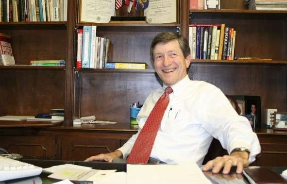 man sits at desk