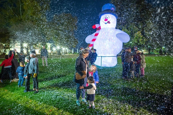 This giant lighted snowman and artificial snow were among the highlights at the annual Lighting of the Tree event.