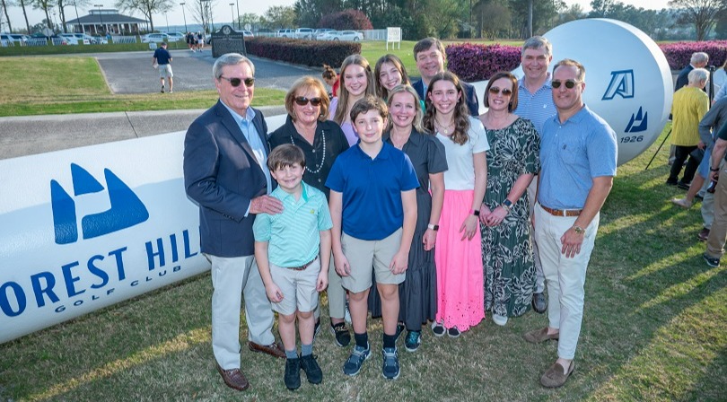 This golf tee sculpture was given by Nick Evans in honor of his wife Beth (pictured here with the Evans family) and Don Grantham.