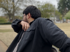 Student coughing into his elbow