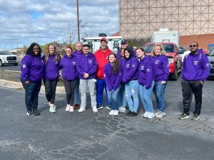 BSN seniors and other volunteers pose in purple Point-in-Time hoodies