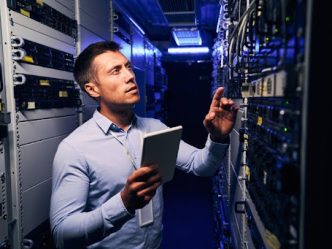 An IT auditor inspects a company’s network servers.