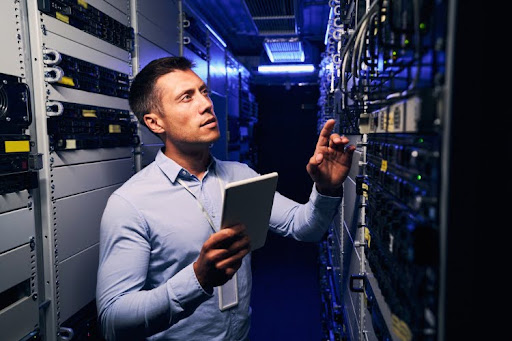An IT auditor inspects a company’s network servers.