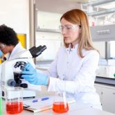Two epidemiologists working in a laboratory.
