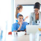 A health care compliance officer meets with a medical team.