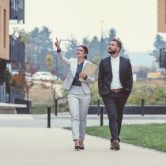 Two urban planners walk through a new development.