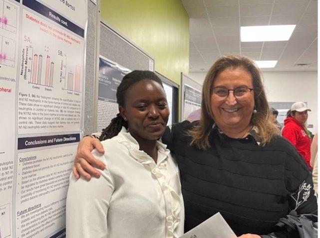 Sheila Ngumbi (BCB) with her mentor, Dr. Manuela Bartoli, at the GRD 2024 Poster Session