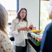 A public health nutritionist discusses a healthy meal plan with a couple.