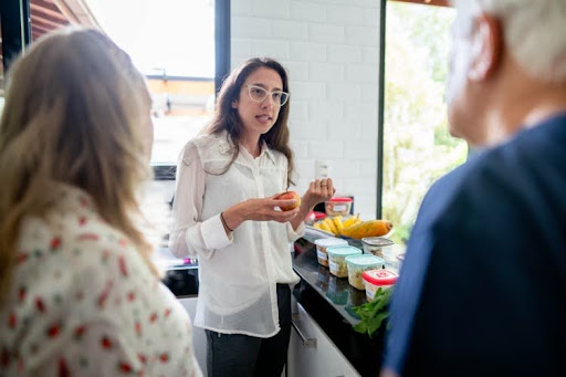 A public health nutritionist discusses a healthy meal plan with a couple.