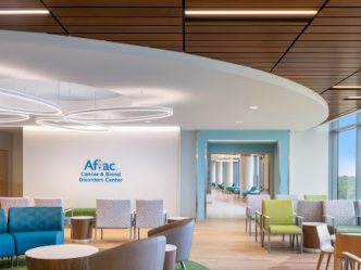 A hospital lobby with blue and green furniture