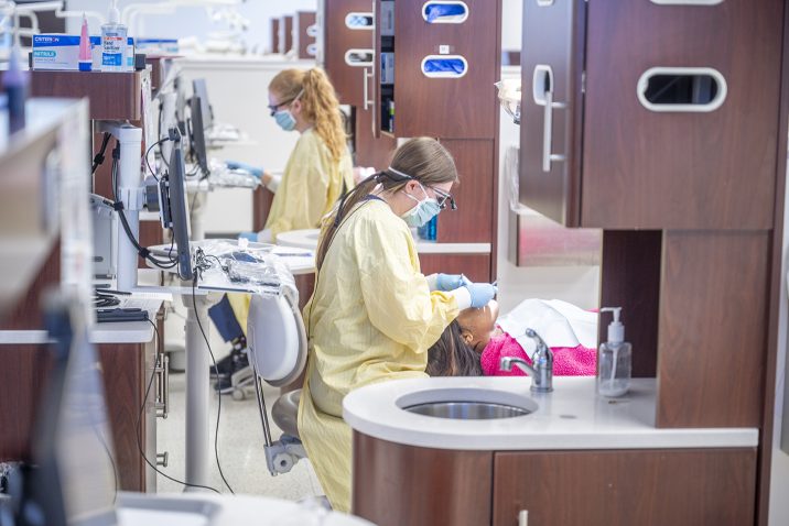 Dental Hygienist working