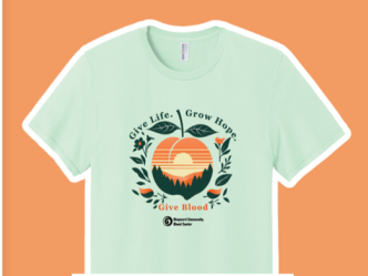 Image of a pale green T-shirt with peach imagery related to the blood donation