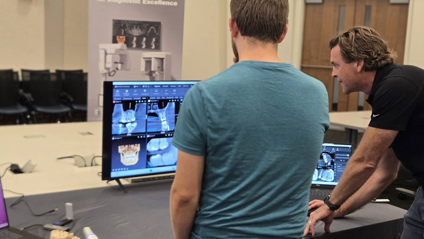 DCG Students and faculty review scanners from several companies.
