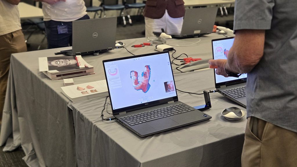 DCG Students and faculty review scanners from several companies.