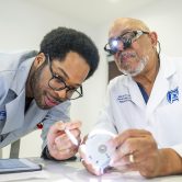 (L-R) Wesley Clark and Dr. Maurice Lewis work in the Simulation Lab at the DCG Building on the Augusta University Health Sciences campus in Augusta Ga.