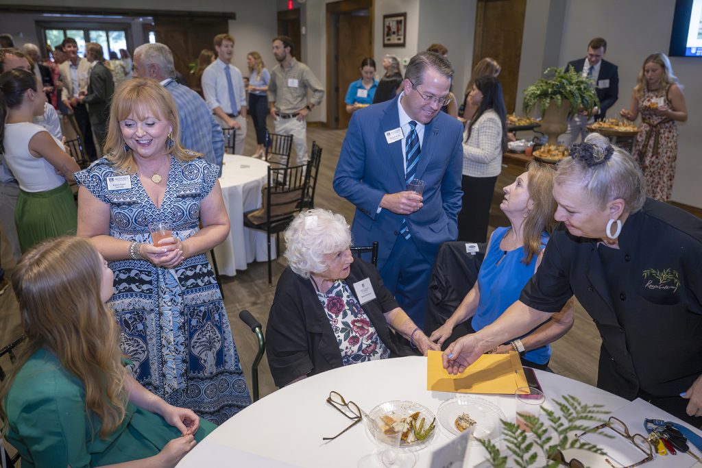 Attendees enjoy hors d'oeuvres and drinks while catching up with colleagues and celebrating scholarship winners.