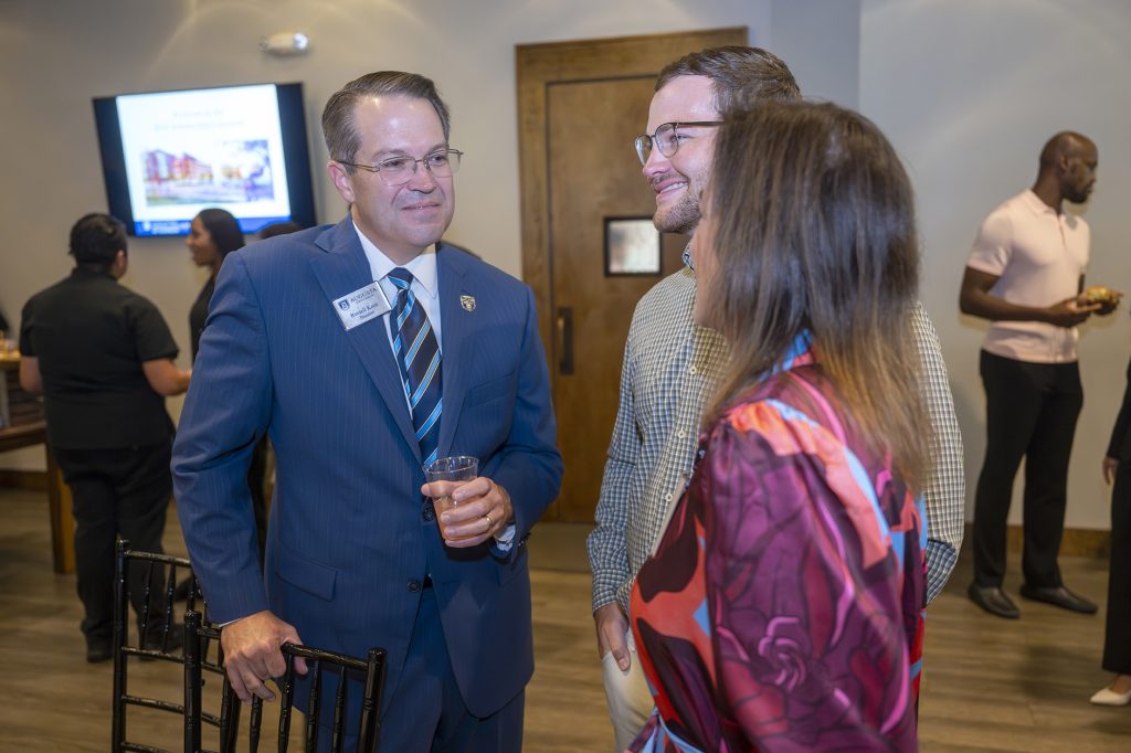 Attendees enjoy hors d'oeuvres and drinks while catching up with colleagues and celebrating scholarship winners.