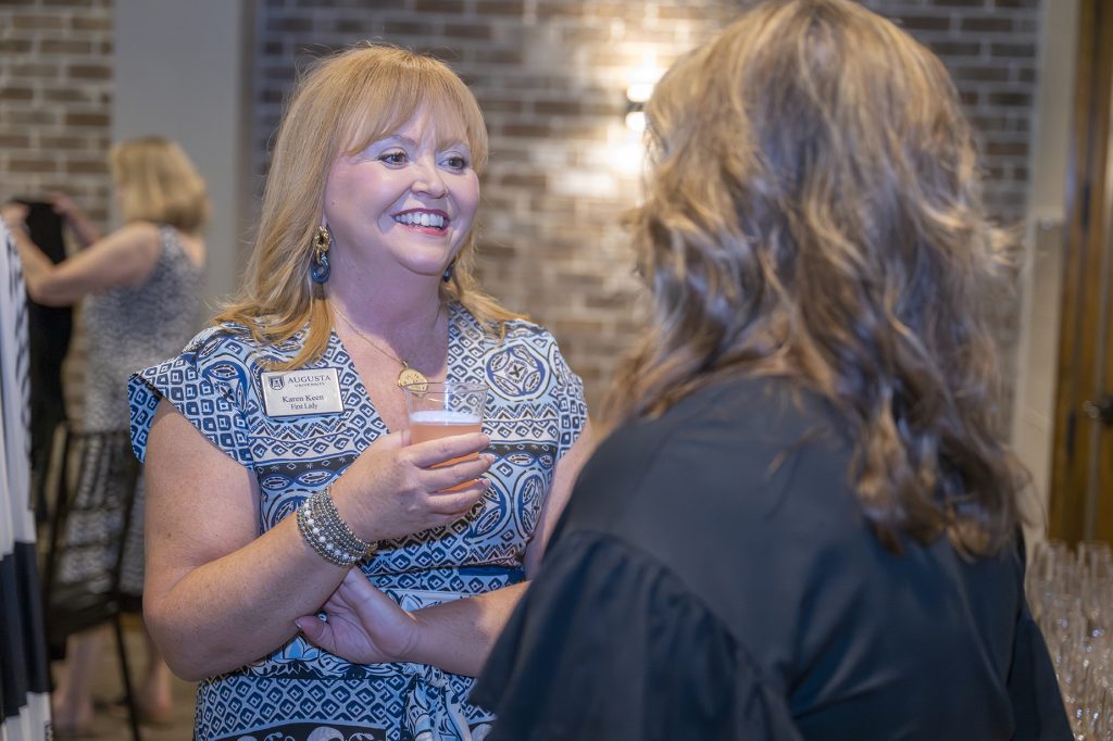 Attendees enjoy hors d'oeuvres and drinks while catching up with colleagues and celebrating scholarship winners.