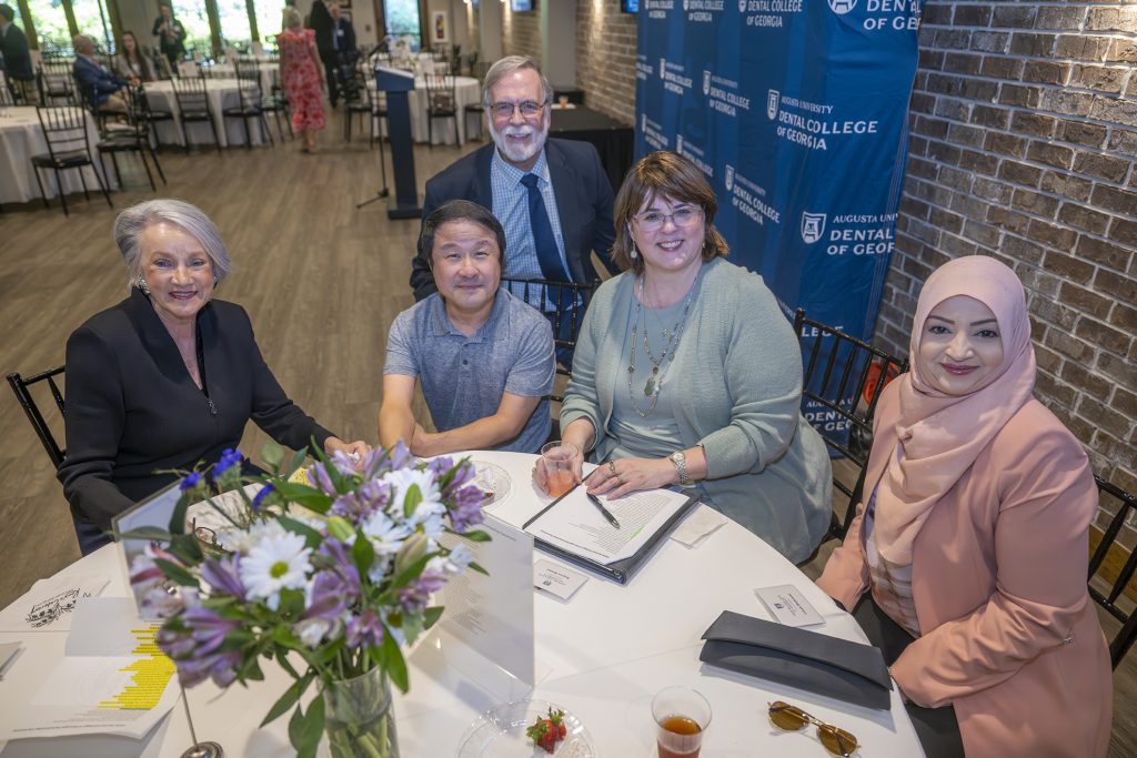 Attendees enjoy hors d'oeuvres and drinks while catching up with colleagues and celebrating scholarship winners.