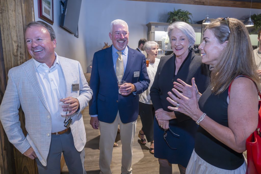 Attendees enjoy hors d'oeuvres and drinks while catching up with colleagues and celebrating scholarship winners.