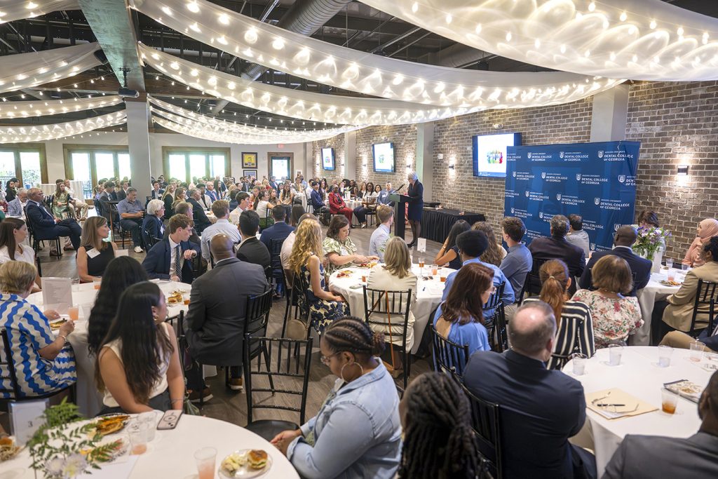 Attendees enjoy hors d'oeuvres and drinks while catching up with colleagues and celebrating scholarship winners.