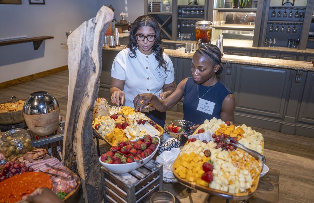 Attendees enjoy hors d'oeuvres and drinks while catching up with colleagues and celebrating scholarship winners.