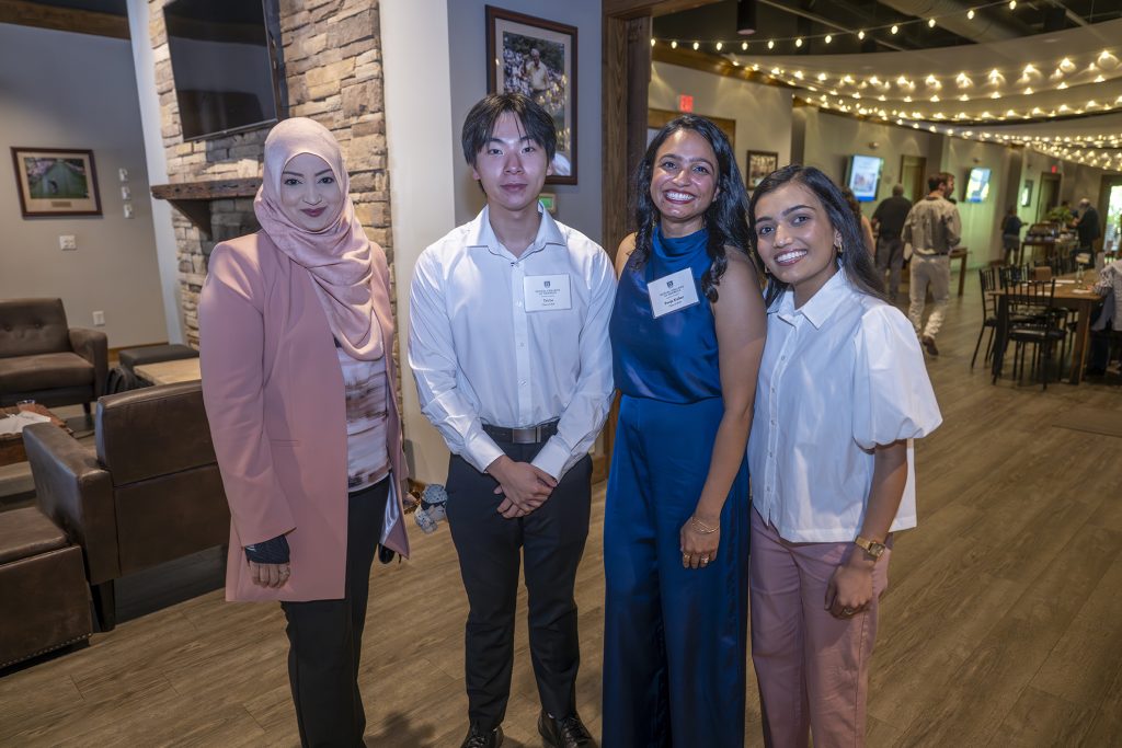 Attendees enjoy hors d'oeuvres and drinks while catching up with colleagues and celebrating scholarship winners.