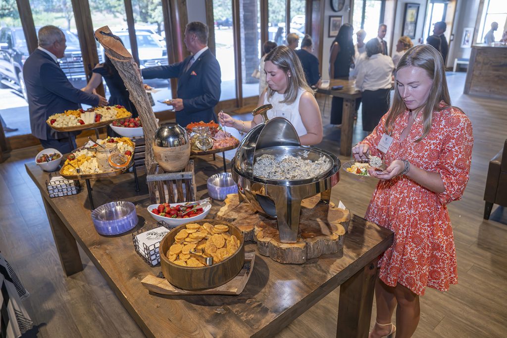 Attendees enjoy hors d'oeuvres and drinks while catching up with colleagues and celebrating scholarship winners.
