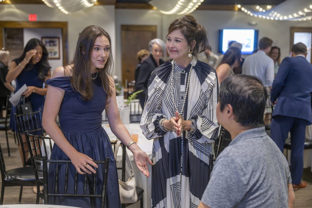 Attendees enjoy hors d'oeuvres and drinks while catching up with colleagues and celebrating scholarship winners.
