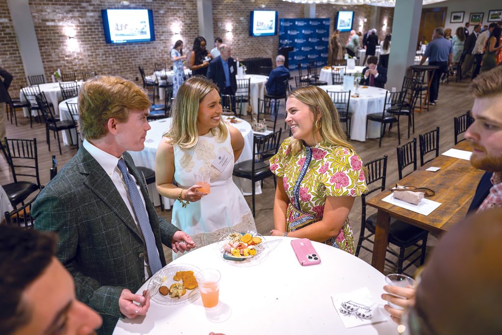Attendees enjoy hors d'oeuvres and drinks while catching up with colleagues and celebrating scholarship winners.