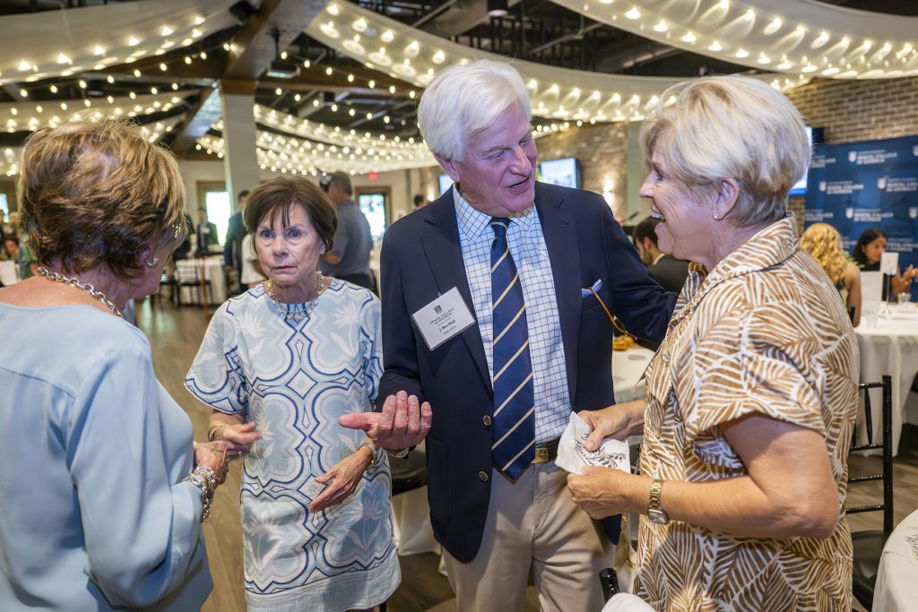 Attendees enjoy hors d'oeuvres and drinks while catching up with colleagues and celebrating scholarship winners.