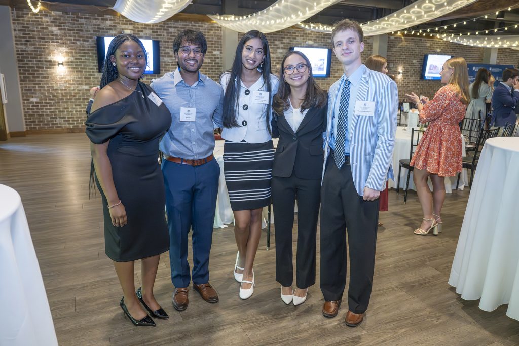 Attendees enjoy hors d'oeuvres and drinks while catching up with colleagues and celebrating scholarship winners.