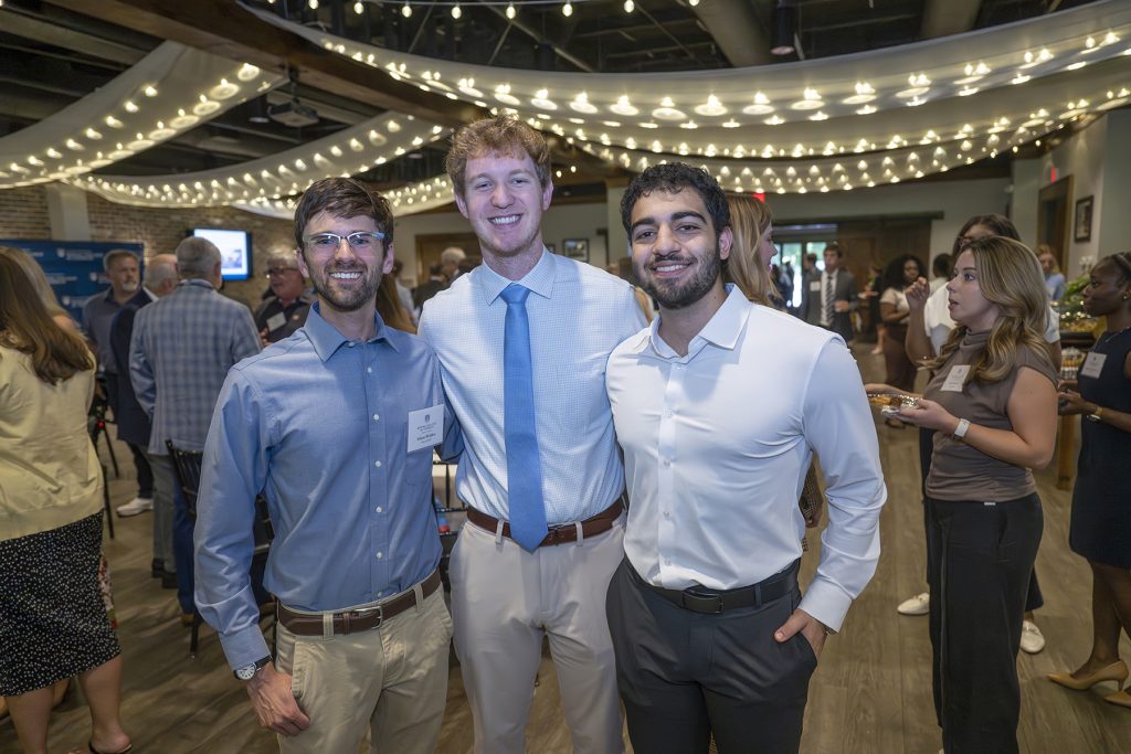 Attendees enjoy hors d'oeuvres and drinks while catching up with colleagues and celebrating scholarship winners.