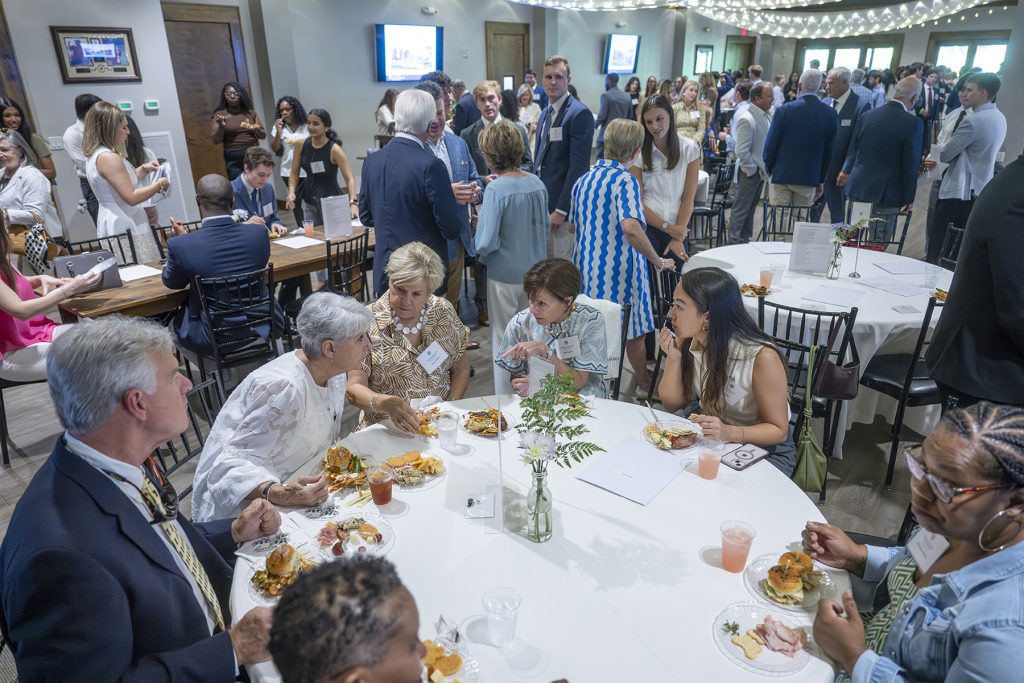 Attendees enjoy hors d'oeuvres and drinks while catching up with colleagues and celebrating scholarship winners.