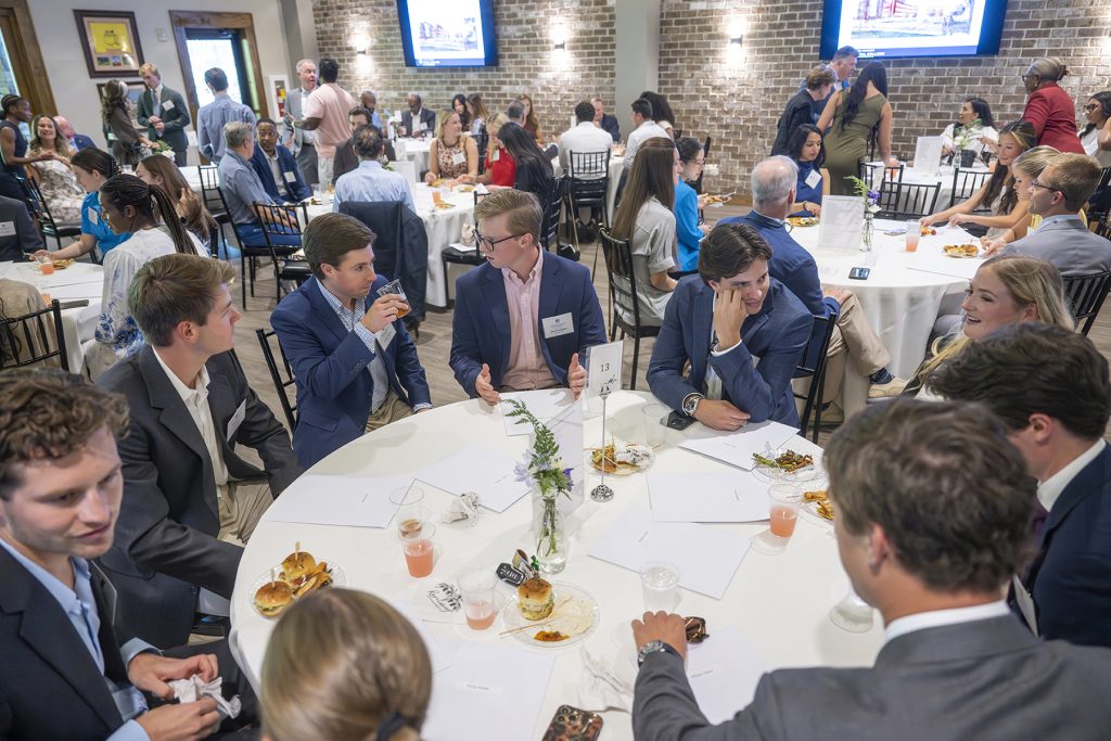 Attendees enjoy hors d'oeuvres and drinks while catching up with colleagues and celebrating scholarship winners.