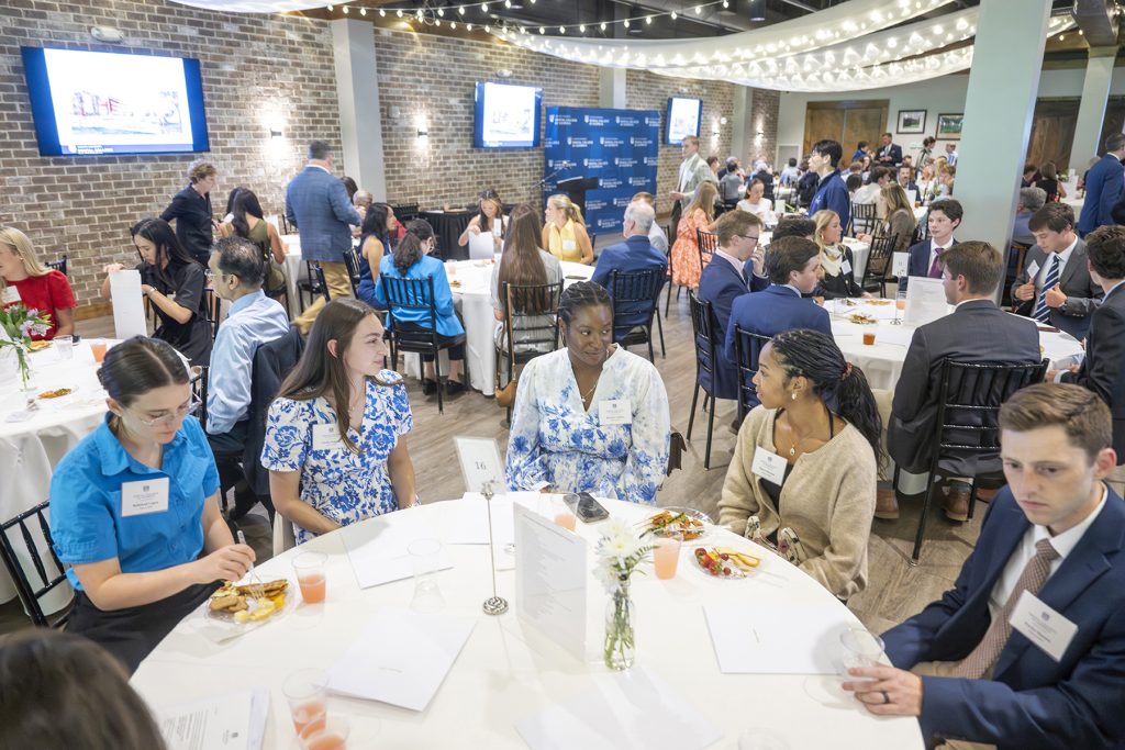 Attendees enjoy hors d'oeuvres and drinks while catching up with colleagues and celebrating scholarship winners.