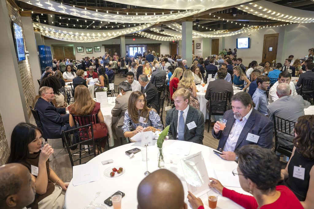 Attendees enjoy hors d'oeuvres and drinks while catching up with colleagues and celebrating scholarship winners.