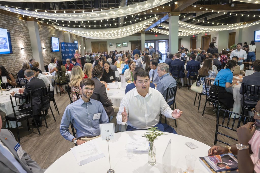 Attendees enjoy hors d'oeuvres and drinks while catching up with colleagues and celebrating scholarship winners.