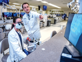 Dental professor teaches in lab